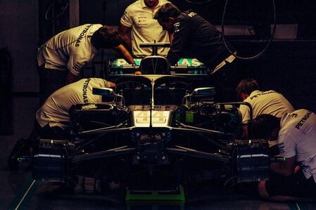 mercedes engineers with f1 bolid