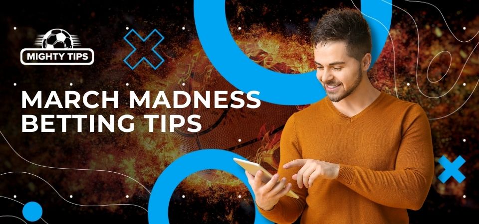 Image for March Madness betting tips featuring a smiling man pointing to the phone